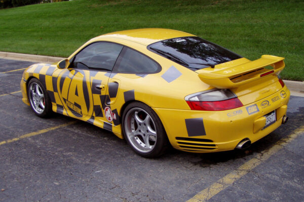 Yellow Porsche rear angle